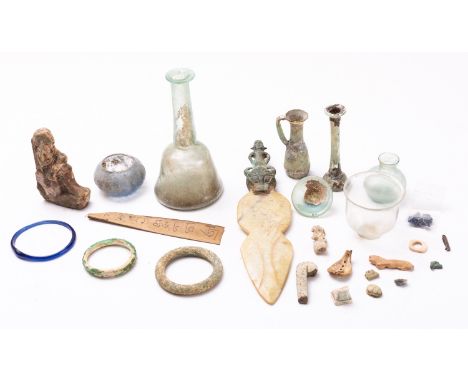 A collection of glass, pottery and stone artefacts, some items probably ancient; including a mallet form bottle, some iridesc