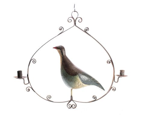 A wrought iron and painted metal twin light chandelier in north European folk art taste, 20th century; modelled with a bird p