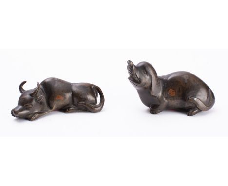 A small Chinese bronze figure of a reclining water buffalo and one similar of an elephant 17th/18th century, 10cm [elephant t