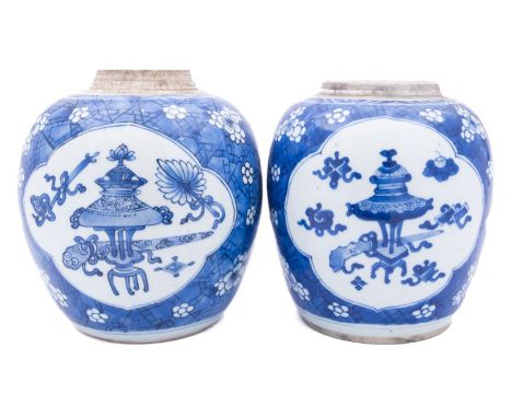 Two Chinese blue and white jars, Kangxi painted with the Hundred Antiques pattern within lotus panels on a cracked ice and pr