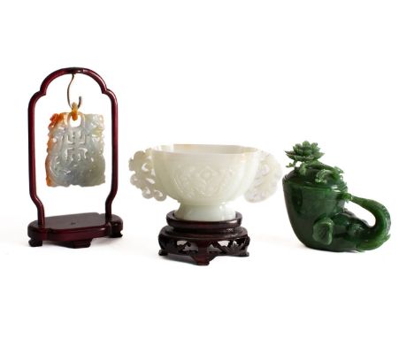 A mixed lot of Chinese carved jade, late 20th century  comprising a pierced pendant with loose suspension ring, 7cm with wood