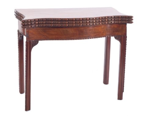 A George III mahogany and line inlaid combined tea and card table, late 18th century; with egg-and-dart carved serpentine fro