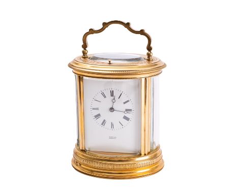 Boxell, Brighton a French late-Victorian engraved oval brass carriage clock the eight-day duration movement having a later pl