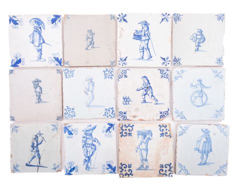 A group of twenty-three Dutch and English blue and white delftware tiles painted with single figural subjects, 18th century, 