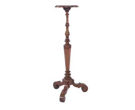 A walnut candle stand in the William and Mary manner, with a quatrelobe and pointed shaped moulded top, on a turned and polyg