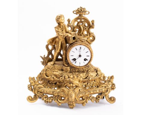 A mid-Victorian gilt-metal clock the eight-day duration movement striking the hours and half-hours on a bell with an outside 