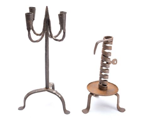 A wrought iron 'rat de cave' candlestick, late 18th century, the candle socket with a spiral formed column, on a dished circu