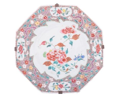 A Chinese famille rose octagonal plate painted  with a central peony spray, the rim with cartouches of peony and lotus reserv
