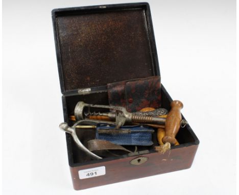 Mixed lot to include a vintage corkscrew, stirrup, glove stretchers, opera glasses, etc contained within a lacquered box