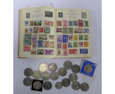 Stamp album together with some coins. 