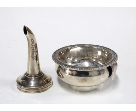 George III silver wine strainer, London 1772, 7cm diameter together with a white metal wine funnel, unmarked  (2)