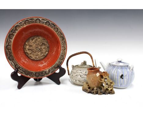 Japanese Banko teapot with a cat finial, 10cm, together with another Japanese striped teapot, a red Italian pottery bowl with
