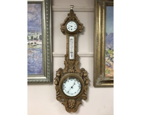 A carved nineteenth century light oak barometer CONDITION REPORT: In good condition. See additional images. 