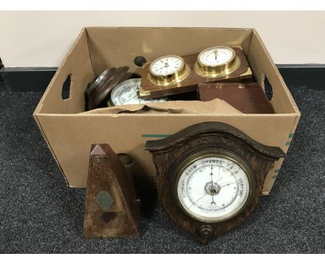 A box containing wooden barometers, metronome, miniature longcase clock, mahogany boxes etc