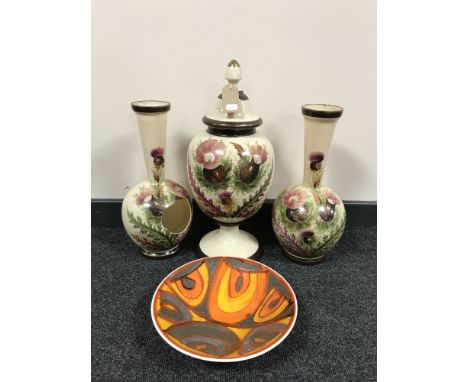 A Poole pottery bowl and an early 20th century hand painted vase trio 