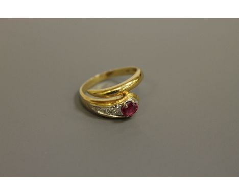 An 18ct gold ruby and diamond snake ring, 4.7g