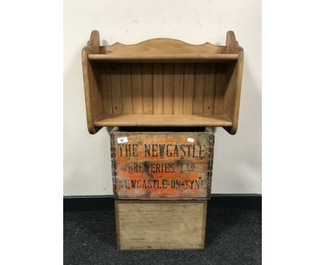 A vintage Newcastle Breweries wooden beer crate together with a small pine box and a pine wall shelf