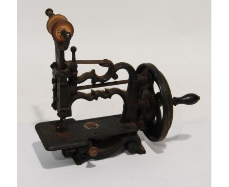 VICTORIAN SMALL MANUAL SEWING MACHINE, with cast iron scroll frame, 8" long (excluding the winding handle) 