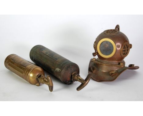 TWO EARLY TWENTIETH CENTURY BRASS CASED JUNIOR PYRENE FIRE EXTINGUISHERS, also a miniature replica brass DIVER'S HELMET (3) 
