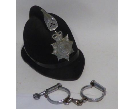 TRADITIONAL SHAPE OLDHAM POLICE CONSTABLES BLACK FELT HELMET together with a pair of CHROMIUM PLATED SHACKLES or HANDCUFFS (2
