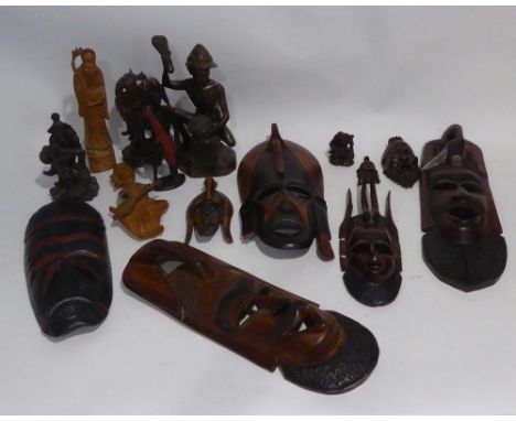 A SELECTION OF POST WAR WEST AFRICAN CARVED WOODEN MASKS, Oriental carved wooden figures etc...... 
