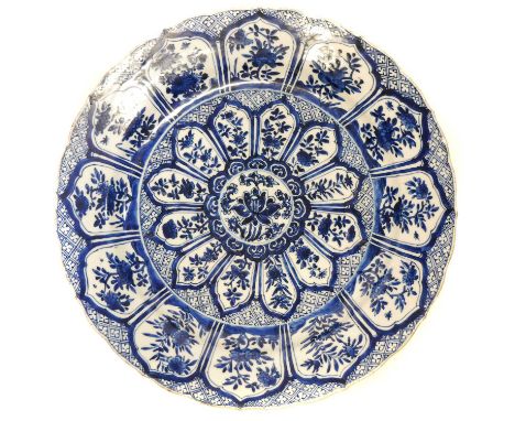 Chinese porcelain charger Chinese porcelain charger, painted with flowers within a paneled field, Qing Dynasty, Kangxi (1662-