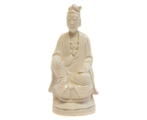 Chinese blanc de chine figure of a scholar Chinese blanc de chine figure of a scholar, modelled seated with on hand holding a