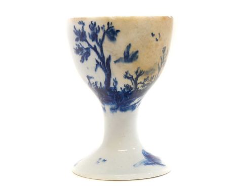 Lowestoft egg cup Lowestoft egg cup circa 1780, printed with birds by a tree in underglaze blue.7.5cm highLarge stained patch
