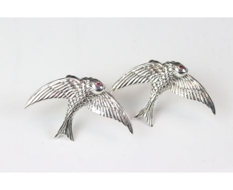 A pair of silver bird cufflinks with ruby eyes. 