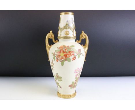 Victorian Royal Worcester twin handled ivory blush vase with gilt and floral detailing. Puce mark to the base. Measures 32cm 