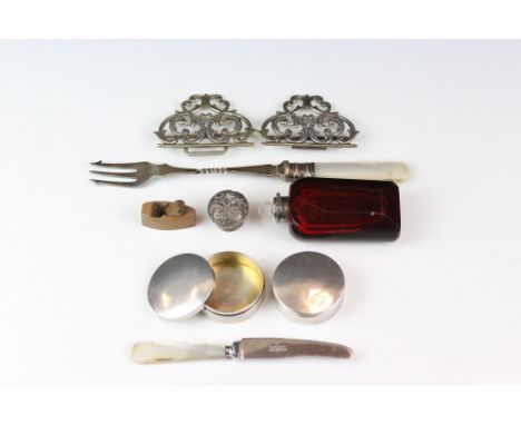 A small group of collectables to include a ruby glass scent bottle, two hallmarked silver pill boxes, nurses belt buckle....e