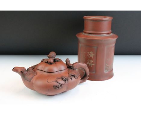 20th Century Chinese Yixing red clay tea pot of gourd form having applied animal and vine leaf detailing. Impressed seal mark