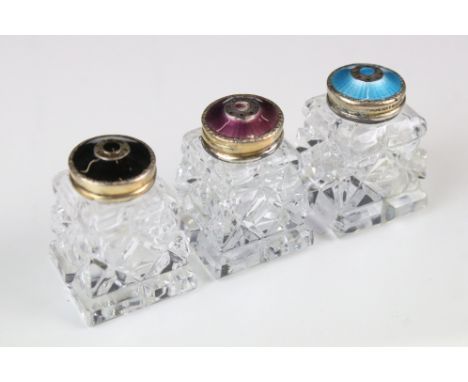 A set of three Norwegian 925 Sterling silver and enamel pepper shakers with gilt decoration. 