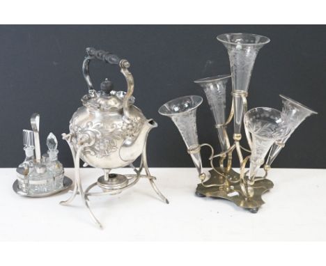 Assortment of silver plates wares to include a teapot and stand with a turned ebonised handle, a cruet set with glass bottles