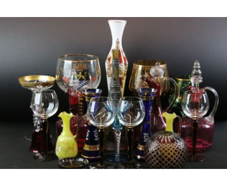 Three Cranberry glass decanters / jugs, a ruby and clear glass cut glass shade, 10cm high and a quantity of other glassware 