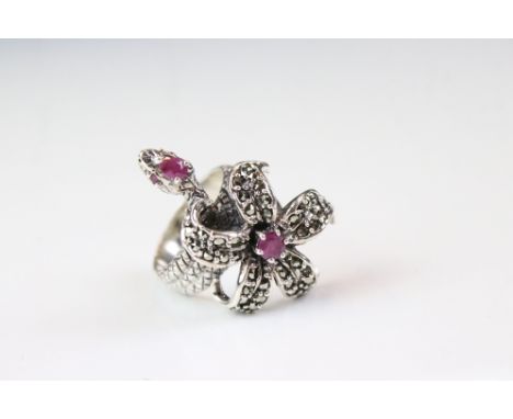 A silver and marcasite snake ring set with ruby cabachons. 