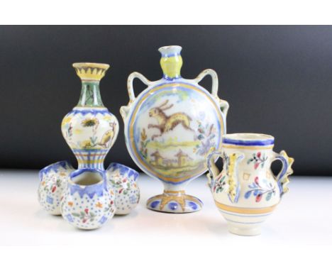 Three pieces of continental faience maiolica ceramics to include a moon flask vase featuring a hare, similar table cruet and 