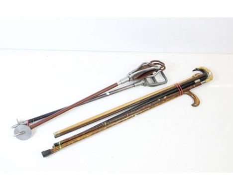 20th Century walking sticks to include two shooting sticks, ebonised stick with a white metal collar, oak stick, marquetry in