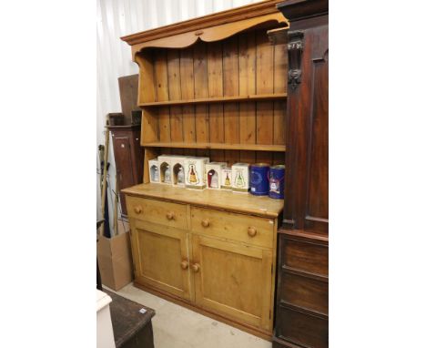 19th century Pine Dresser with a two shelf plate rack to back above two drawers and two cupboard doors, 137cm long x 47cm dee