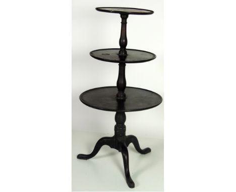 An Irish Georgian period mahogany three tier circular Dumbwaiter, with turned pillar support on tripod base, 122cms (48") hig