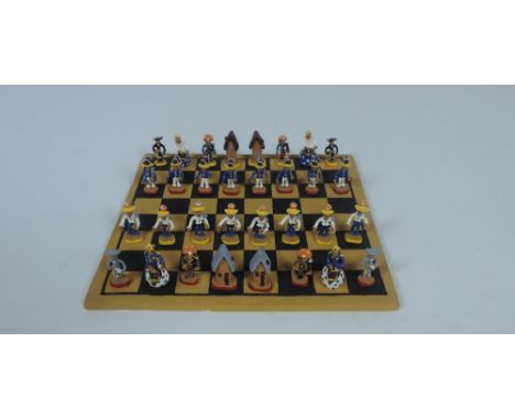 A very unusual Chess Set, with earthenware tile chessboard, and 32 very small hand made earthenware chessmen, each brightly h
