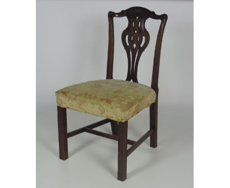 An old Chippendale style carved mahogany Side Chair, the pieced splat back over upholstered seat on front fluted legs. (1)