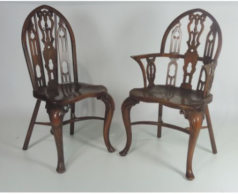 A set of four wooden Windsor type Chairs, two carvers and two singles, with pierced latted arch backs in the Gothic Chippenda
