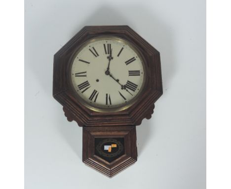 A wooden cased Wall Clock, the circular enamel dial with Roman numerals, and brass pendulum. (1)