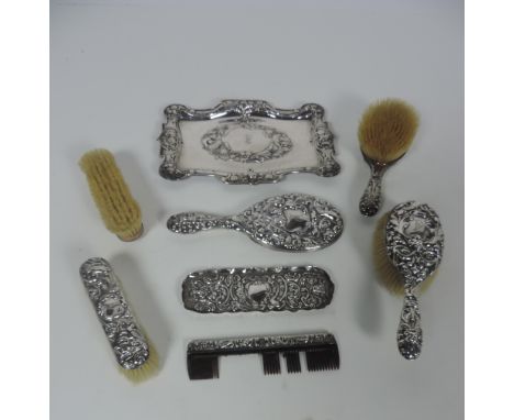 A mixed but very attractive early 20th Century silver Dressing Table Set, consisting of large rectangular tray decorated in t