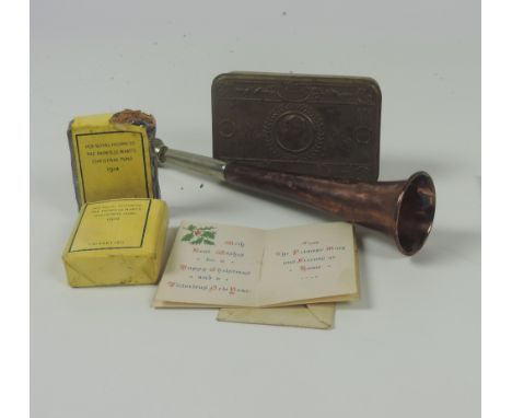 A World War I Princess Mary brass Cigarette Box, Christmas 1914, together with two packs of original cigarettes and original 