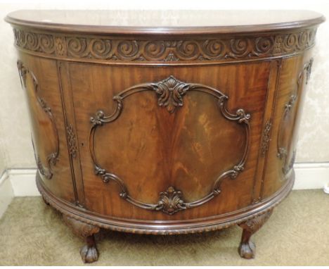 An attractive 20th Century carved and finely figured mahogany demi-lune Commode, in the manner of Thomas Chippendale by Warin