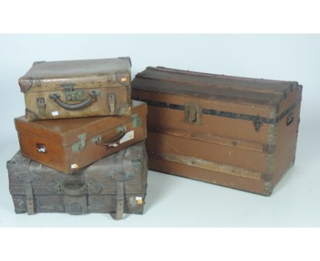 Three heavy antique leather Suitcases, and a dome top canvas Trunk. (4)