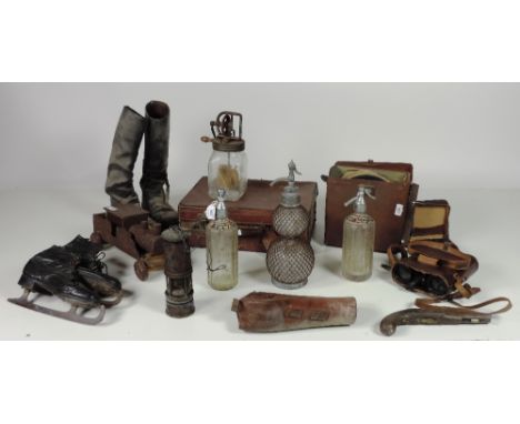 Film Props etc., A large box containing pair of leather Hunting Boots, leather Skating Shoes, a heavy leather case, leather c