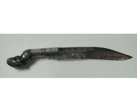 A rare and attractive heavy silver mounted Oriental Dagger, profusely decorated with flowers scrolls and with short steel bla